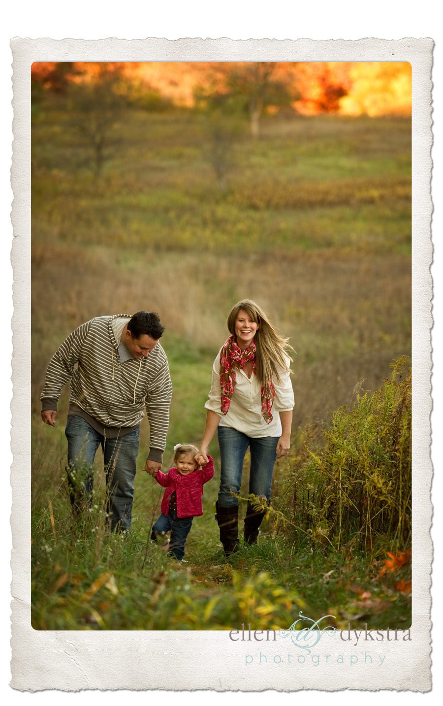 toddler_with_family_in_field