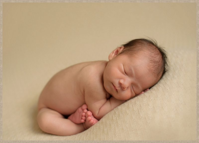 curled up newborn pose
