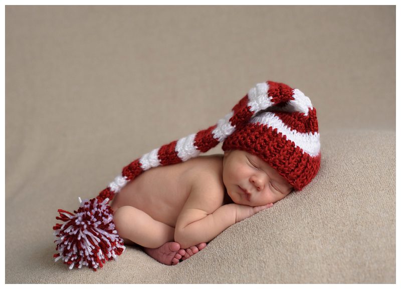 newborn in striped stocking hat
