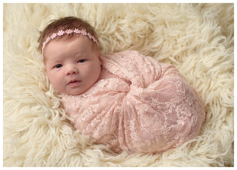 baby-girl-in-pink-lace-wrap