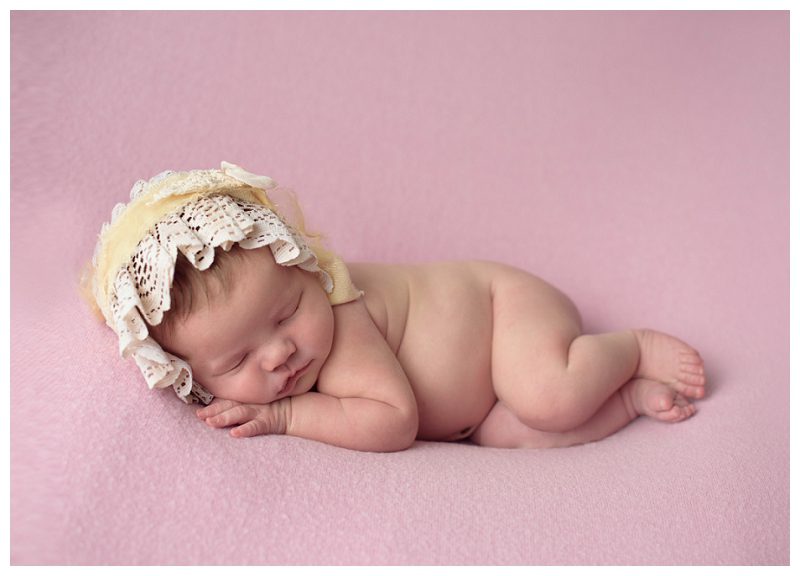 baby-girl-on-pink-blanket
