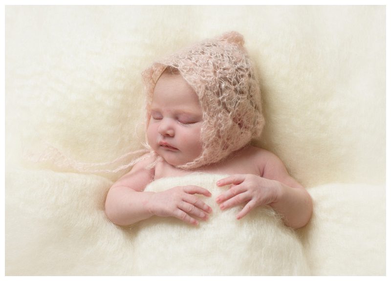 baby-in-knitted-lace-bonnet