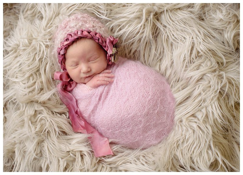 baby-girl-in-pink-hat-and-wrap