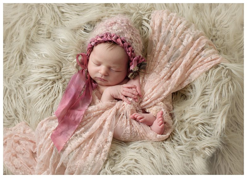 baby-girl-in-pink-lace-and-hat