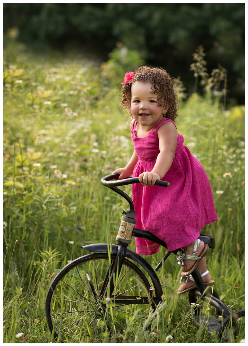 toddler-outdoors-on-vintage-tricycle