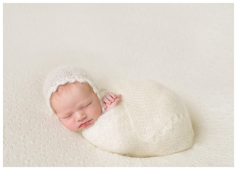 newborn-girl-in-white-knits