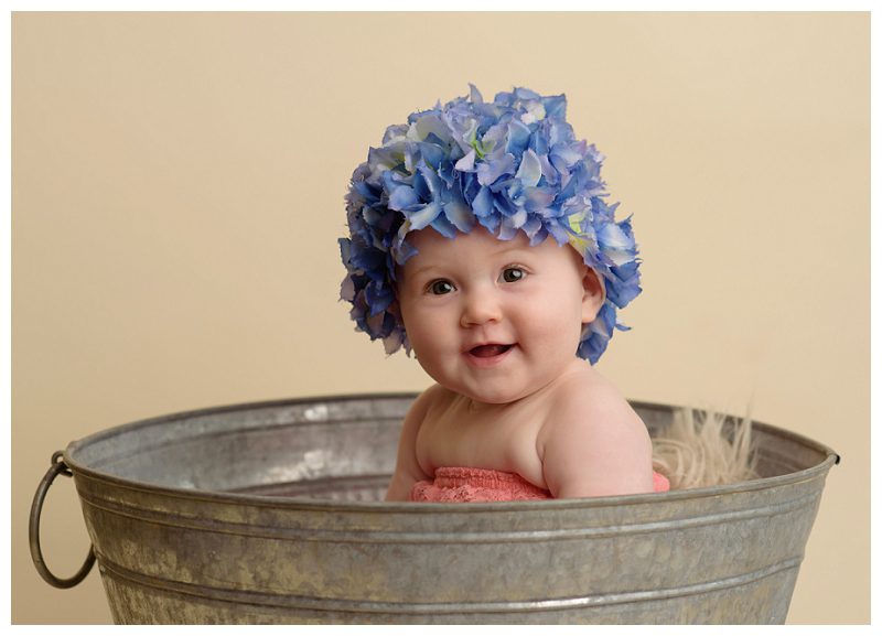 six-month-old-in-flower-hat