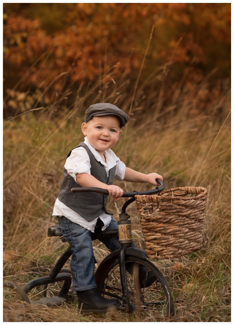 boy-on-vintage-tricycle-in-fall-colors