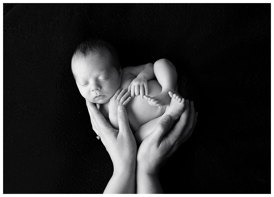 black-and-white-newborn-in-mom's-hands