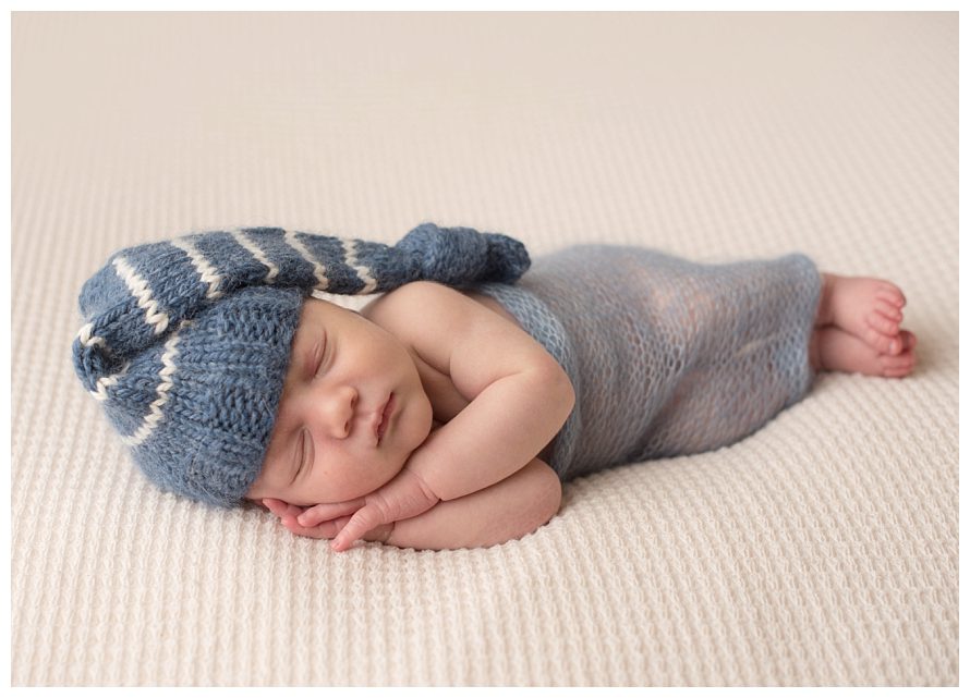 newborn-wearing-striped-hat
