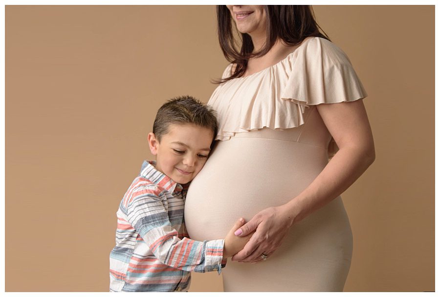 preschool boy in maternity picture with mom