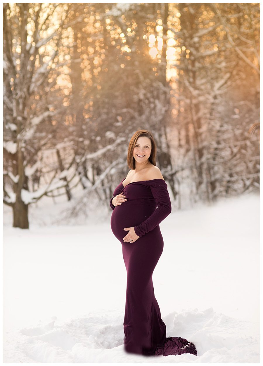 snowy winter maternity photo session with gown