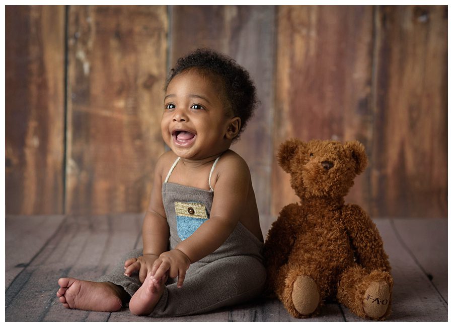 six month old boy with teddy bear