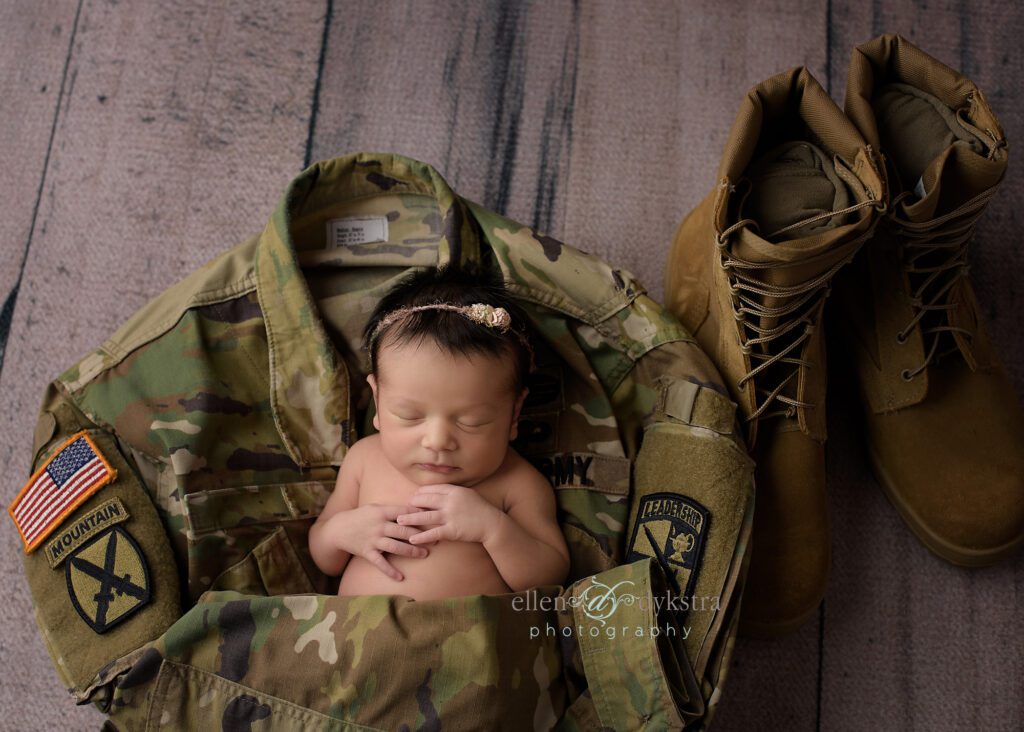 newborn picture with army jacket and boots